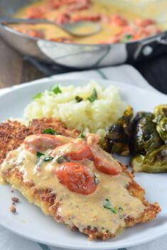 Parmesan Crusted Tilapia with Tomato Basil Cream Sauce - Collection Of The Best Delicious Tilapia Recipes