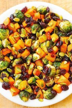 Roasted Brussels Sprouts Salad with Maple Butternut Squash Pumpkin Seeds and Cranberries - 30 Best Easy And Delicious Brussels Sprouts Recipes For Your Meals